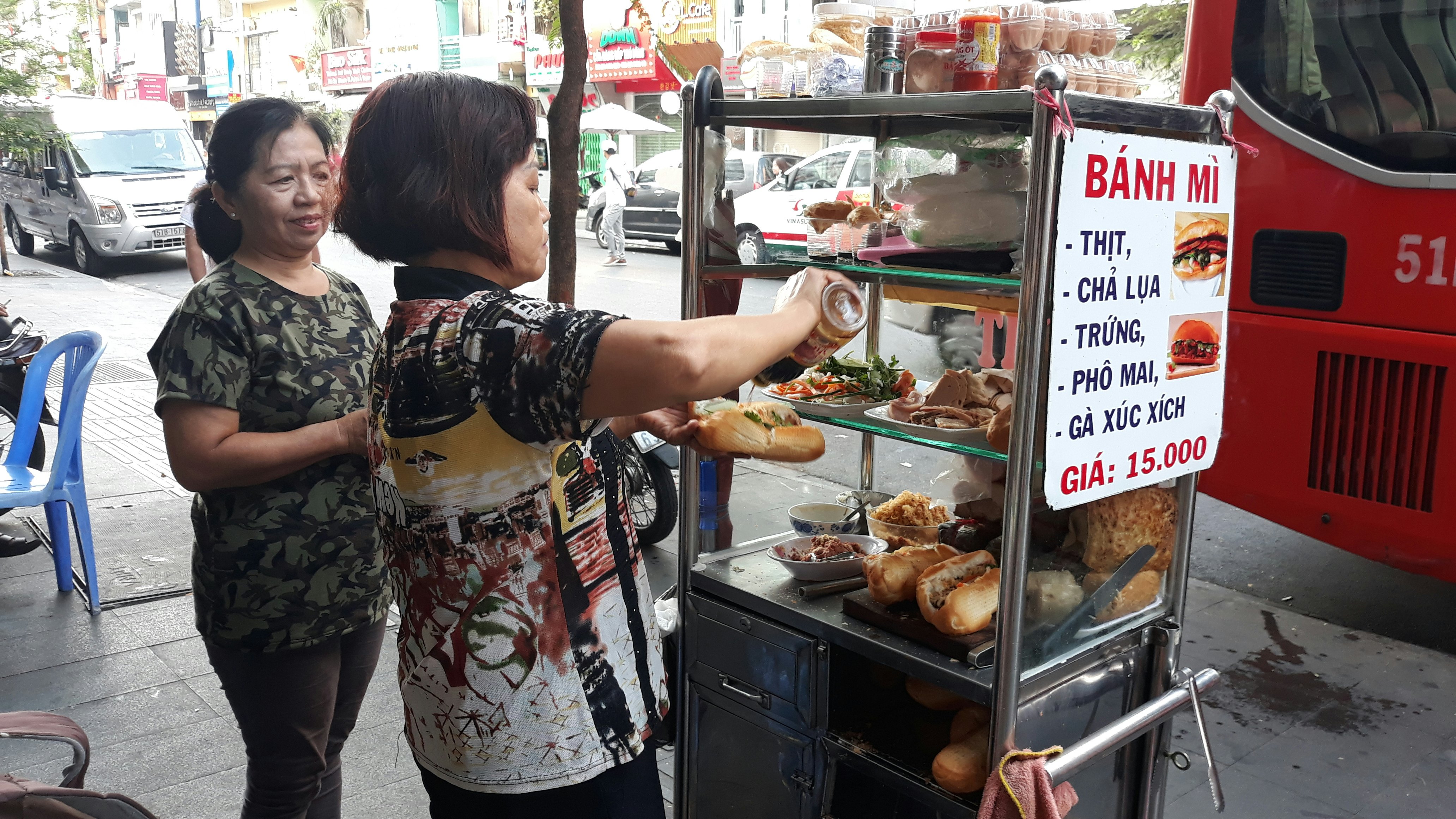 District 1 , Ho Chi Minh City, Vietnam - March 6, 2019 -Banh Mi , Vietnamese Baguette seller in District 1, Popular Backpacker Area in Ho Chi Minh City License Type: media Download Time: 2023-04-06T12:57:35.000Z User: nic.dhoedt_lonelyplanet Is Editorial: Yes purchase_order: