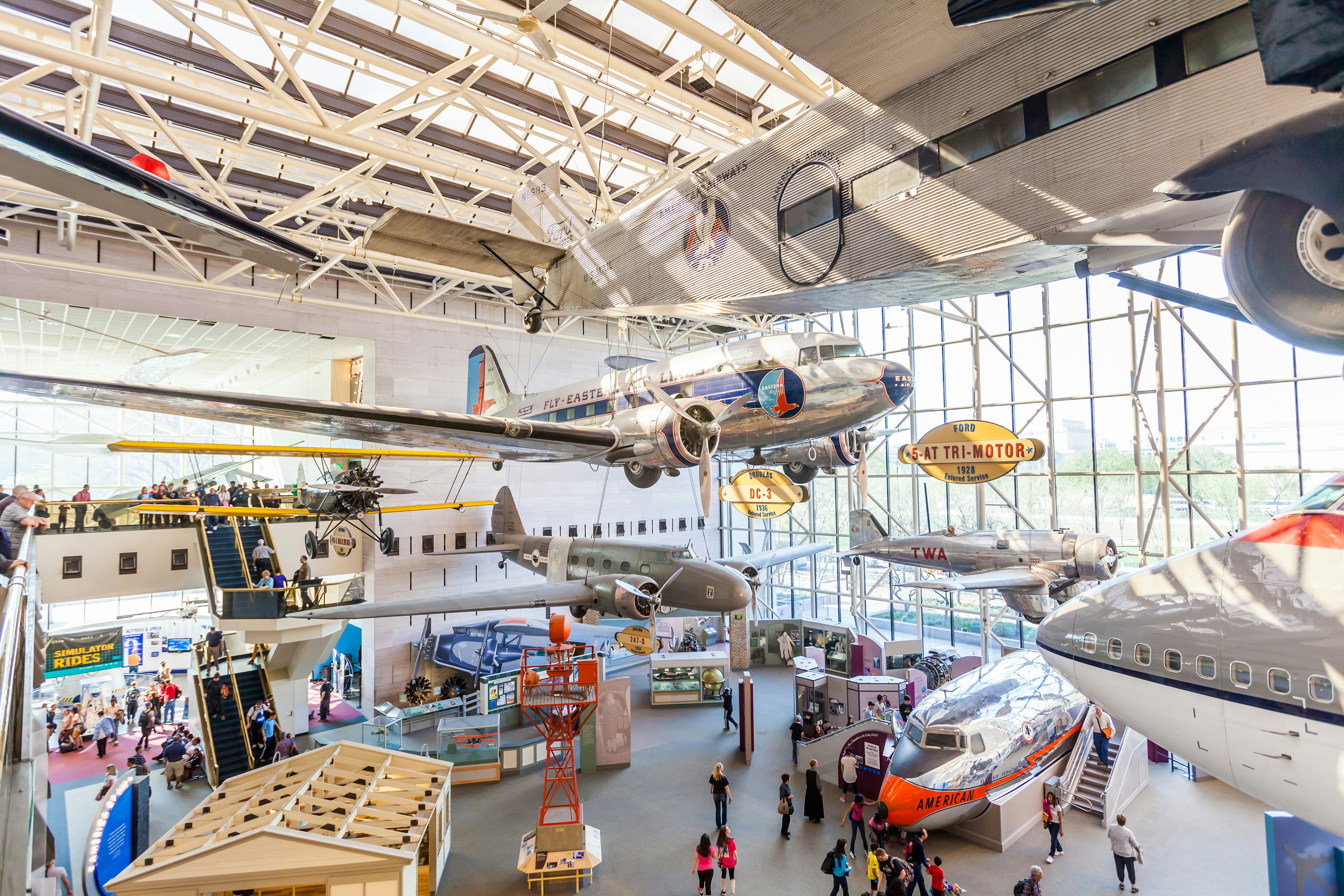 A large gallery of planes and other flying machines within a museum