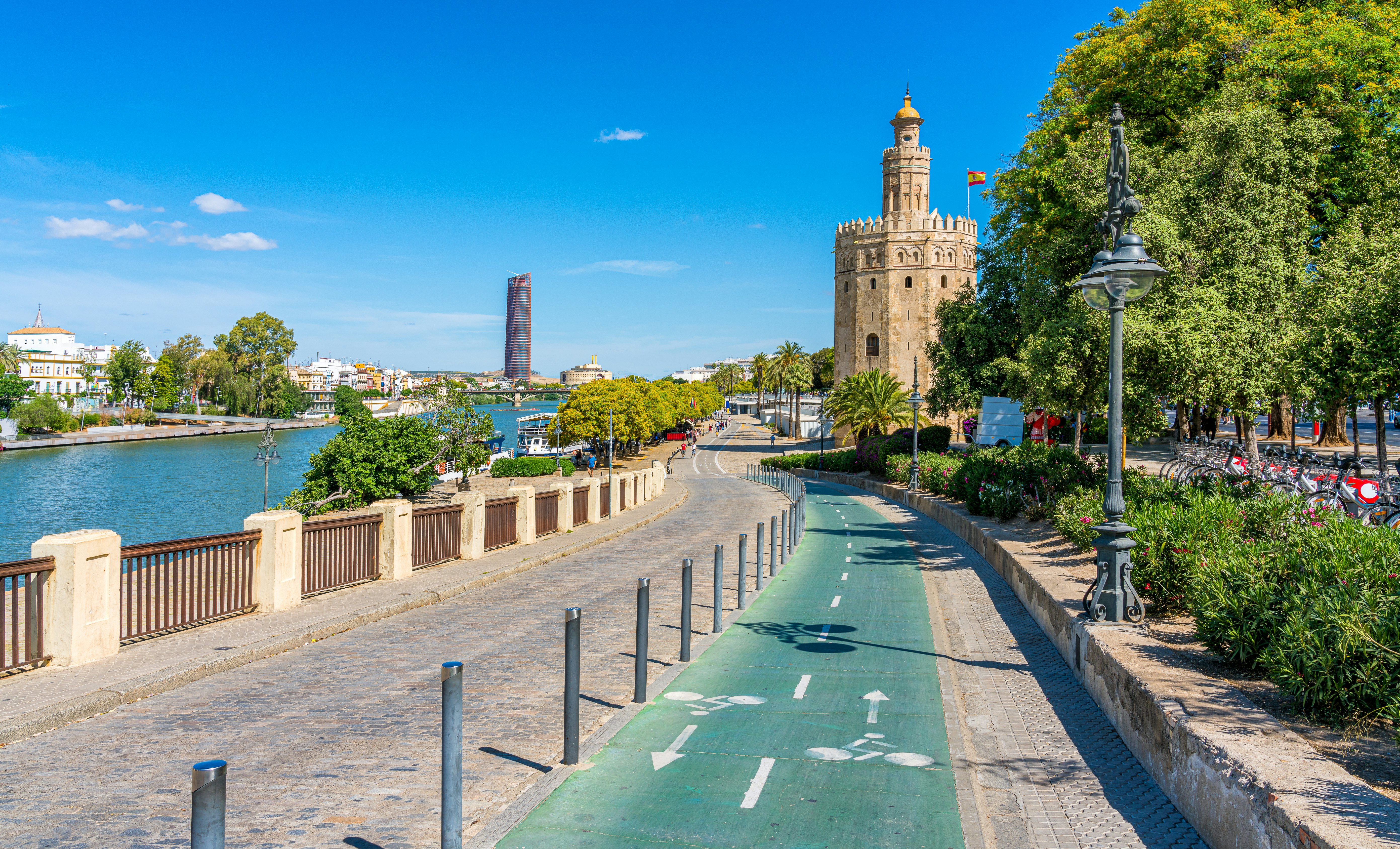 A riverside path split in two, with the cycle lane marked in green