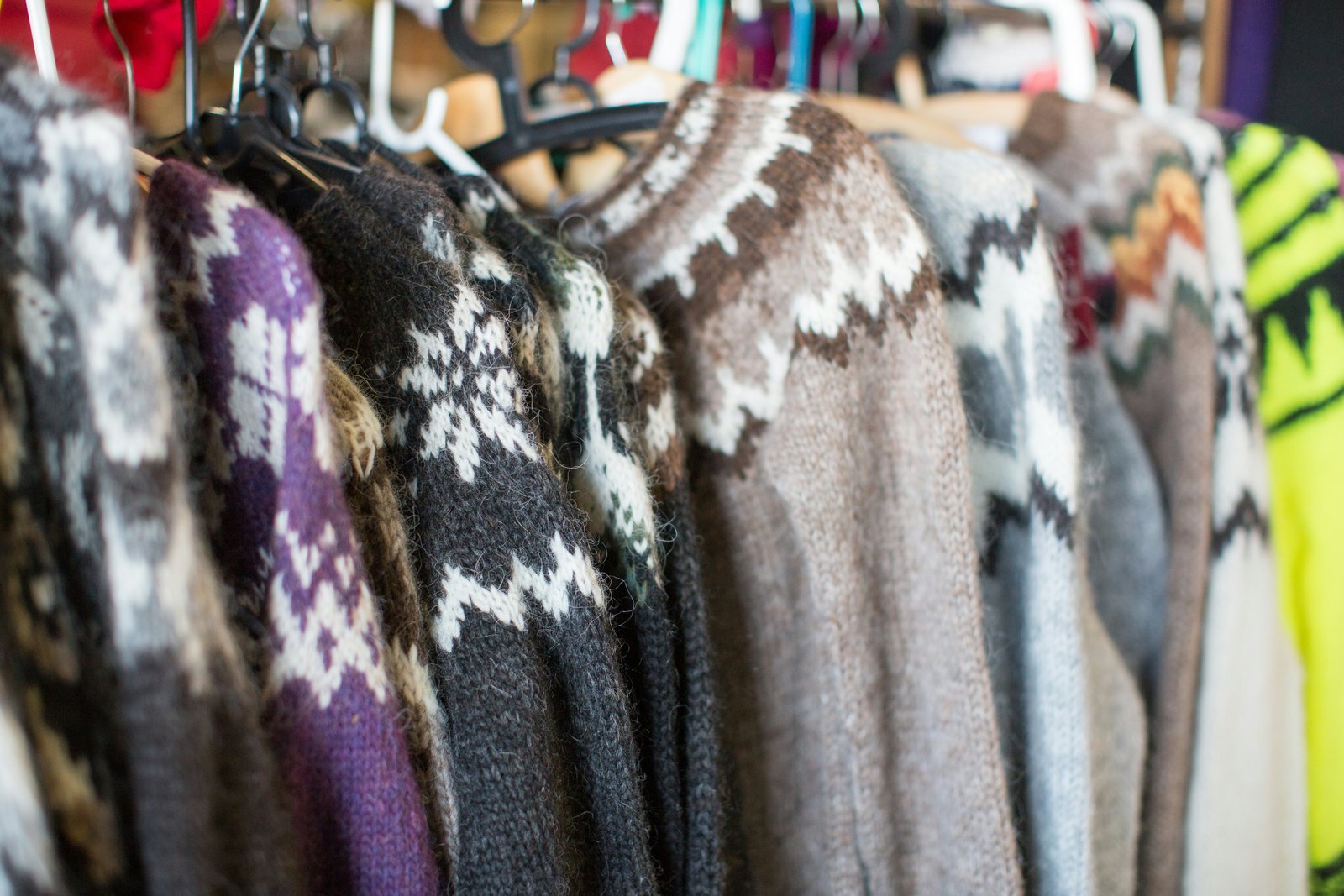 A rail of Traditional Icelandic wool jumpers for sale in Reykjavik Flea Market.