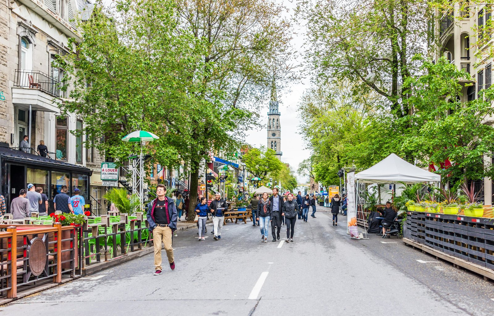 People walking on Saint Denis street in Montreal's Plateau Mont Royal in Quebec region.