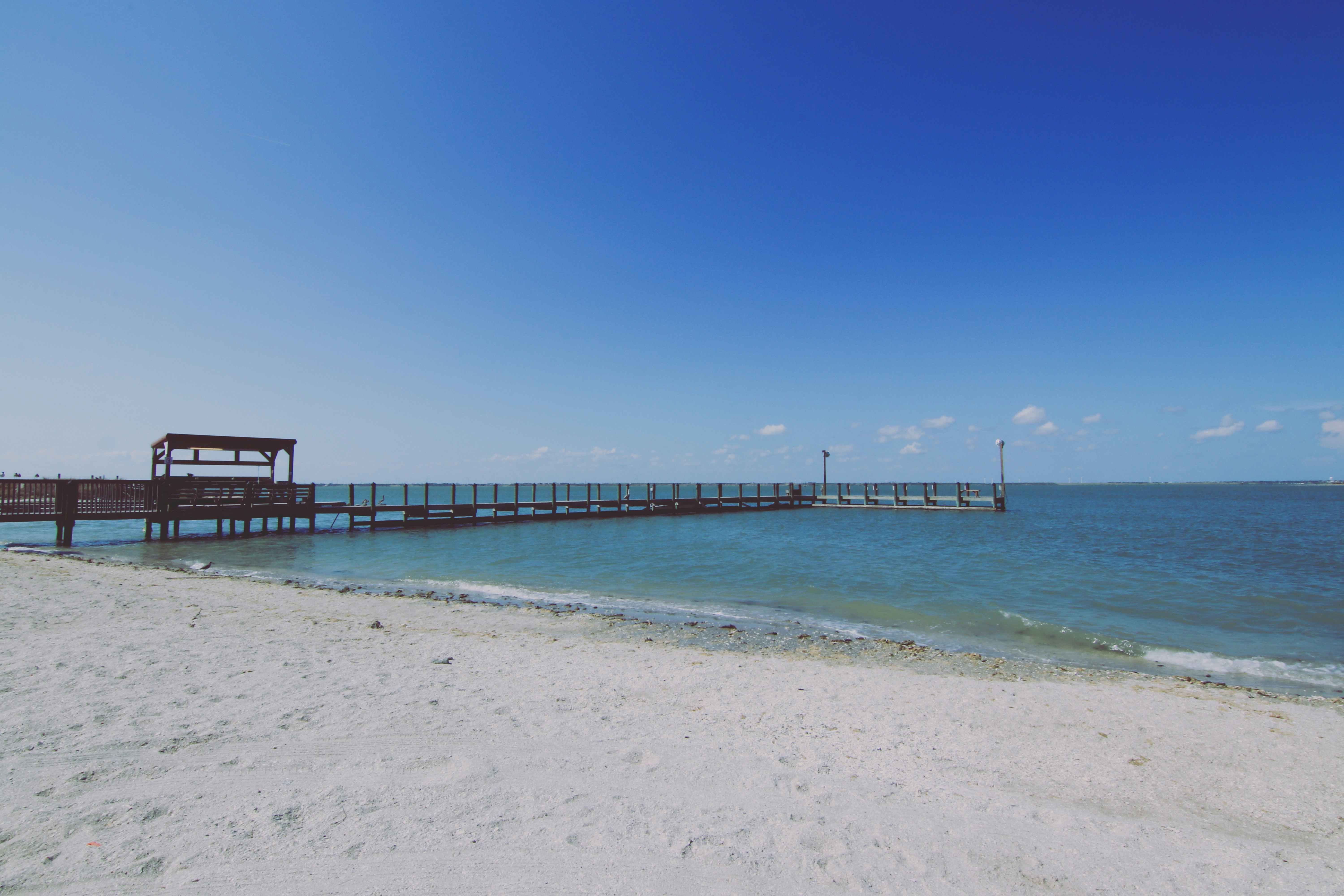 Horace Caldwell Pier on Mustang Island in Corpus Christi, Texas on a sunny day