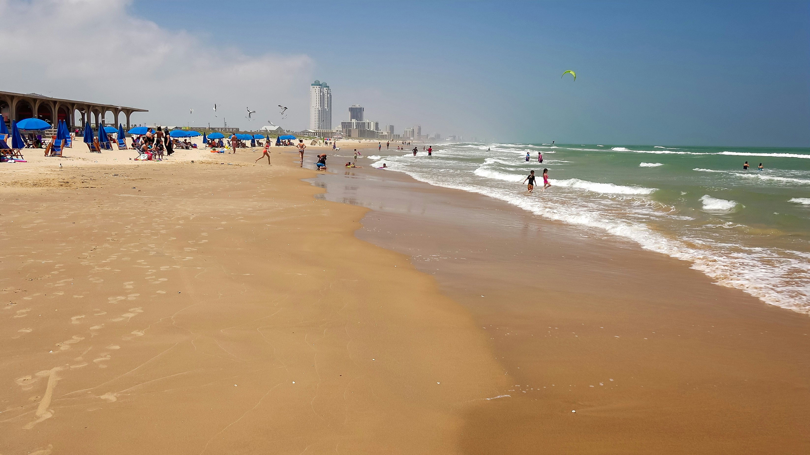 Beachgoers enjoying a Gulf of Mexico beach on South Padre Island